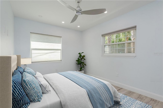 1152 Jackmar Rd, Dunedin, FL 34698 - bedroom with light wood-style flooring, baseboards, ceiling fan, and recessed lighting