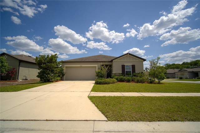 ranch-style house with stucco siding, an attached garage, driveway, and a front lawn