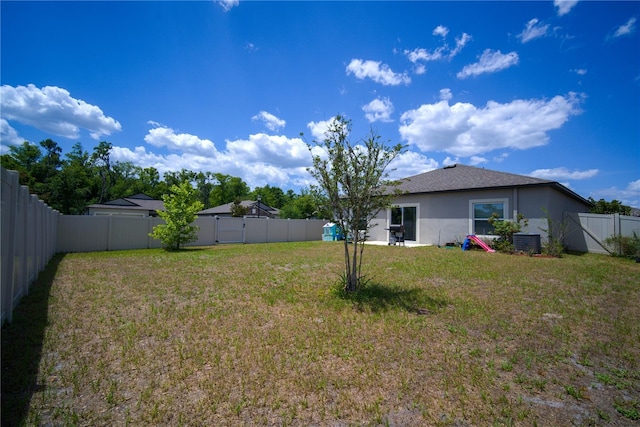 view of yard featuring a fenced backyard and cooling unit