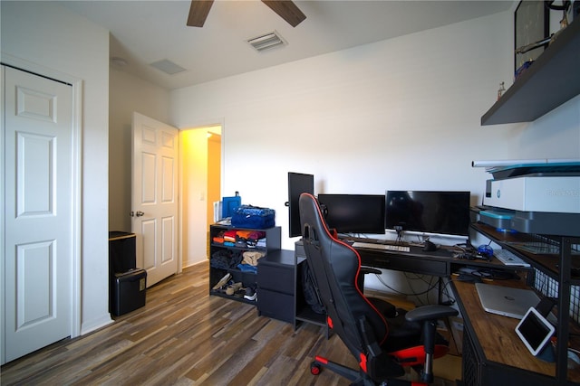office area with visible vents, wood finished floors, and ceiling fan