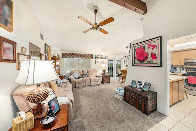living room with french doors, a ceiling fan, a textured ceiling, light tile patterned floors, and light carpet