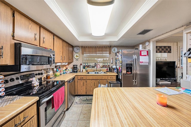 kitchen featuring visible vents, light countertops, a sink, and appliances with stainless steel finishes
