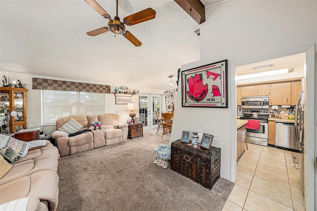 616 Highview Cir S, Brandon, FL 33510 - living room with ceiling fan, a textured ceiling, light tile patterned floors, french doors, and light colored carpet