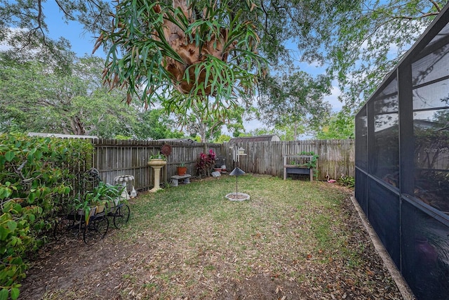 616 Highview Cir S, Brandon, FL 33510 - fenced backyard with a lanai