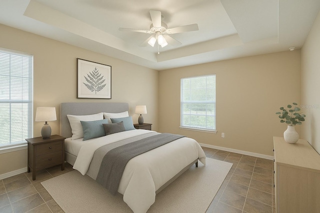 1 Pecan Course Cir, Ocala, FL 34472 - bedroom featuring a ceiling fan, a tray ceiling, baseboards, and tile patterned floors