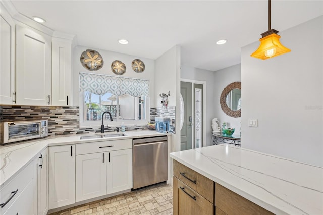 kitchen featuring a sink, a toaster, white cabinetry, dishwasher, and decorative backsplash