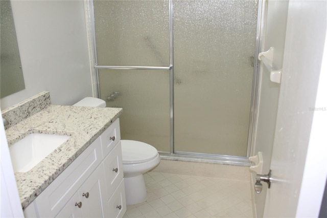 full bath featuring vanity, tile patterned floors, a shower stall, and toilet