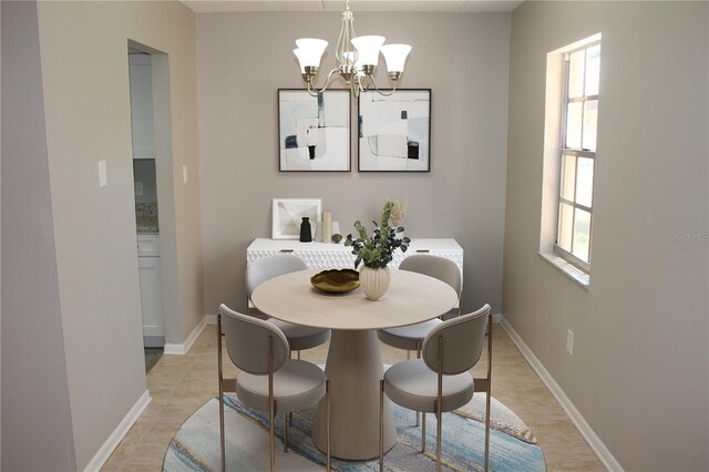 4725 Joseph Ct Unit 233, Tampa, FL 33614 - dining room featuring a chandelier, healthy amount of natural light, and baseboards