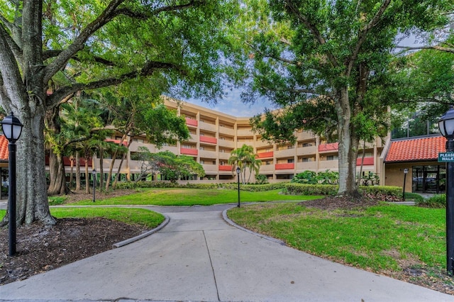 surrounding community with a lawn