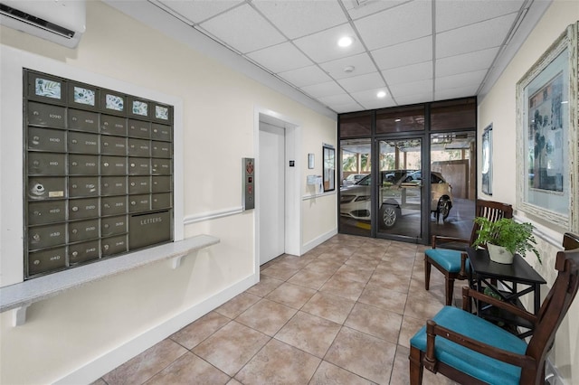 lobby with a paneled ceiling and recessed lighting