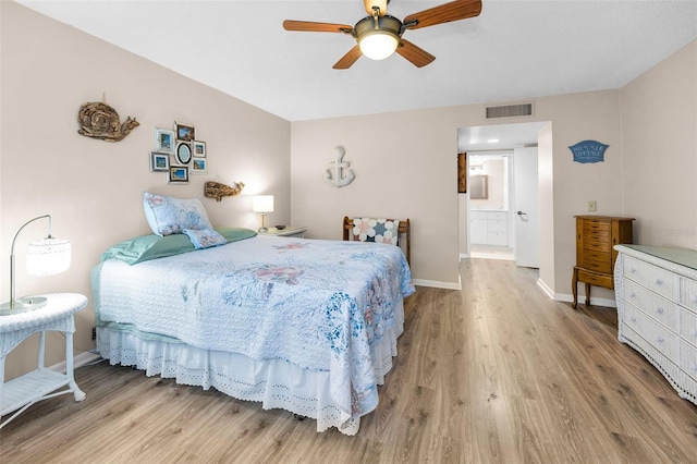 bedroom with light wood finished floors, baseboards, and ceiling fan
