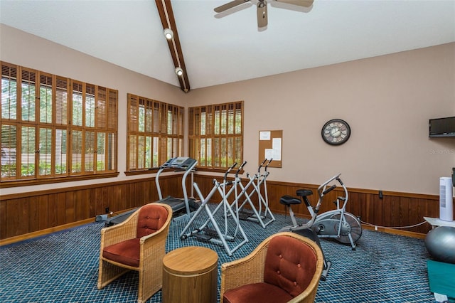game room with carpet floors, wainscoting, ceiling fan, wooden walls, and beamed ceiling