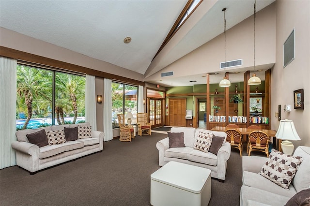 living room featuring carpet floors and high vaulted ceiling