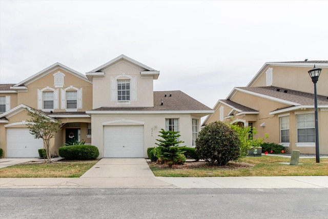 6260 Olivedale Dr, Riverview, FL 33578 - townhome / multi-family property with stucco siding, an attached garage, and driveway
