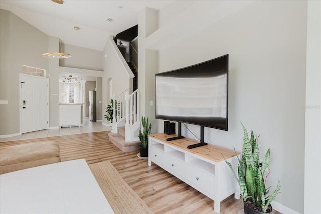 6260 Olivedale Dr, Riverview, FL 33578 - entryway with stairway, wood finished floors, and baseboards