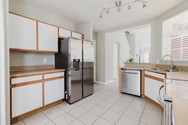 6260 Olivedale Dr, Riverview, FL 33578 - kitchen with stainless steel appliances, a sink, white cabinets, and light countertops