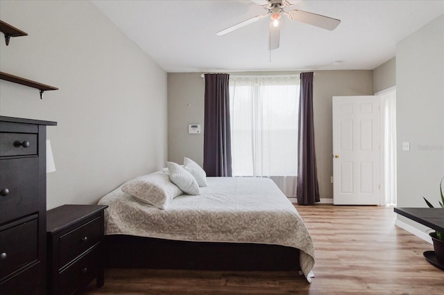 6260 Olivedale Dr, Riverview, FL 33578 - bedroom with light wood finished floors, ceiling fan, and baseboards