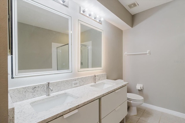 6260 Olivedale Dr, Riverview, FL 33578 - bathroom featuring a stall shower, tile patterned floors, toilet, and double vanity