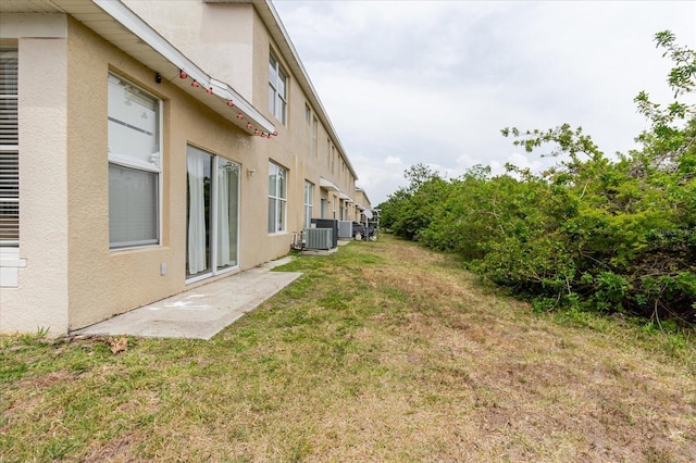 6260 Olivedale Dr, Riverview, FL 33578 - view of green lawn with central AC