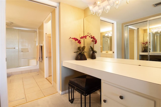 bathroom with tile patterned flooring, a chandelier, baseboards, visible vents, and a stall shower
