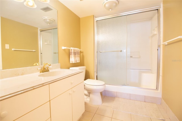 bathroom featuring tile patterned flooring, visible vents, and a shower stall