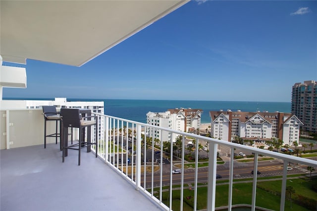 balcony featuring a water view