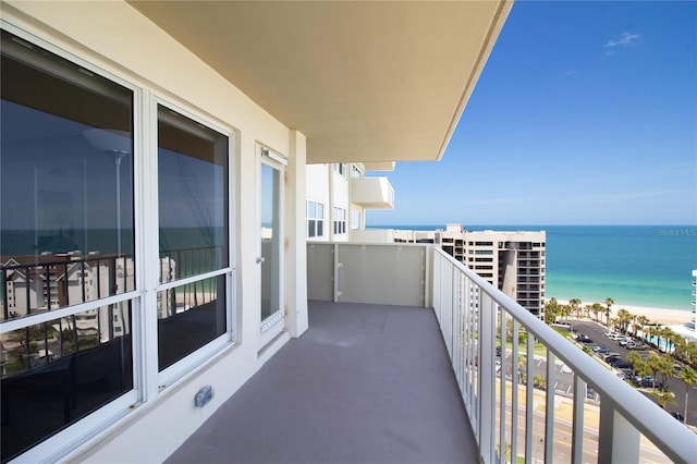 balcony featuring a water view