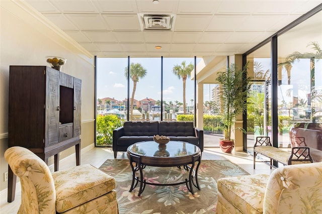 sunroom featuring plenty of natural light and visible vents