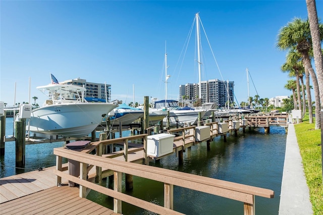 view of dock with boat lift and a water view