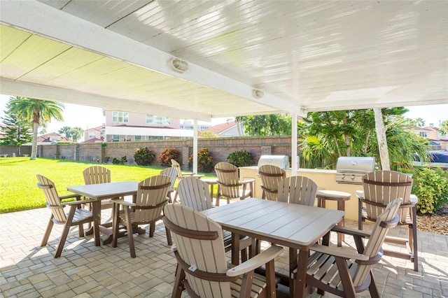 view of patio / terrace featuring a fenced backyard, outdoor dining space, grilling area, and area for grilling