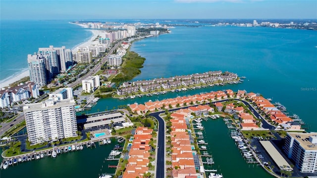 birds eye view of property featuring a water view and a city view