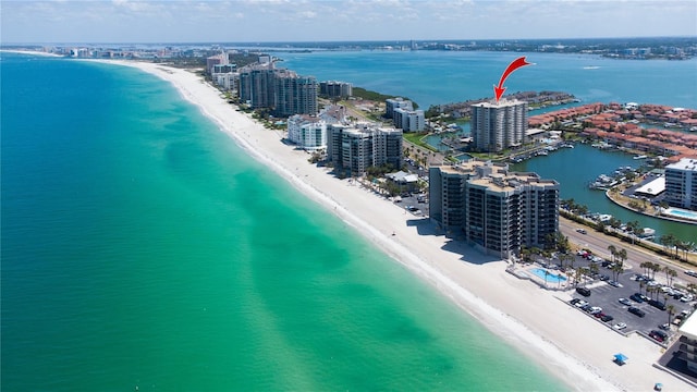 bird's eye view featuring a view of city, a view of the beach, and a water view