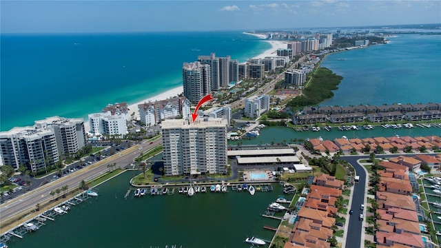 birds eye view of property featuring a water view and a city view