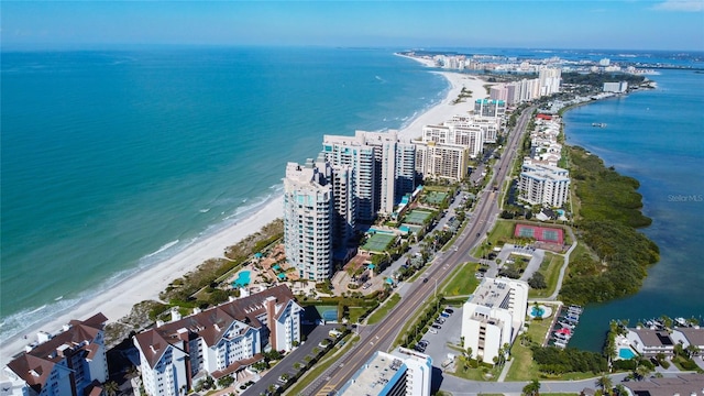 birds eye view of property with a city view, a beach view, and a water view