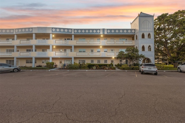 view of property with uncovered parking