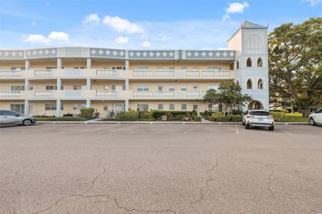 view of property with uncovered parking