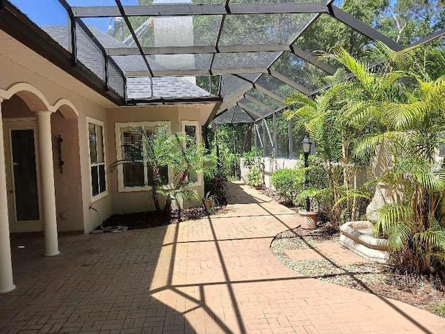 view of patio / terrace with a lanai