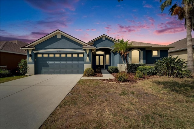 16516 Bridgewalk Dr, Lithia, FL 33547 - single story home featuring concrete driveway, a garage, stucco siding, and a front yard