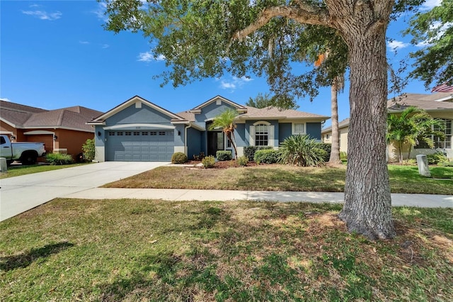 16516 Bridgewalk Dr, Lithia, FL 33547 - single story home with a front yard, an attached garage, stucco siding, and driveway