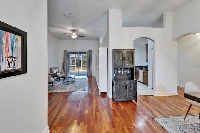16516 Bridgewalk Dr, Lithia, FL 33547 - interior space with hardwood / wood-style floors, visible vents, arched walkways, a ceiling fan, and baseboards