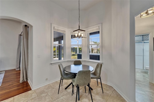 16516 Bridgewalk Dr, Lithia, FL 33547 - dining room with an inviting chandelier, baseboards, and arched walkways