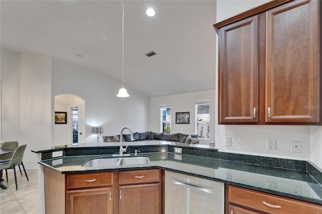 16516 Bridgewalk Dr, Lithia, FL 33547 - kitchen with a sink, lofted ceiling, open floor plan, arched walkways, and stainless steel dishwasher
