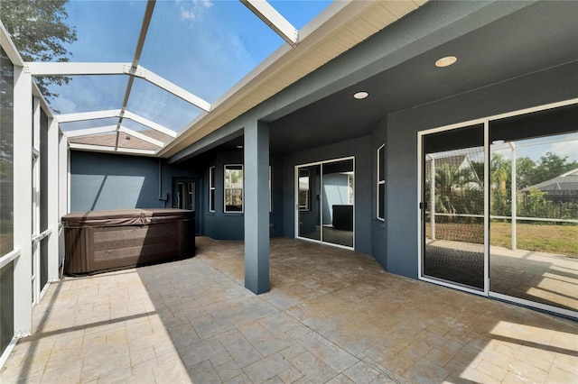 16516 Bridgewalk Dr, Lithia, FL 33547 - view of patio / terrace featuring a hot tub and a lanai