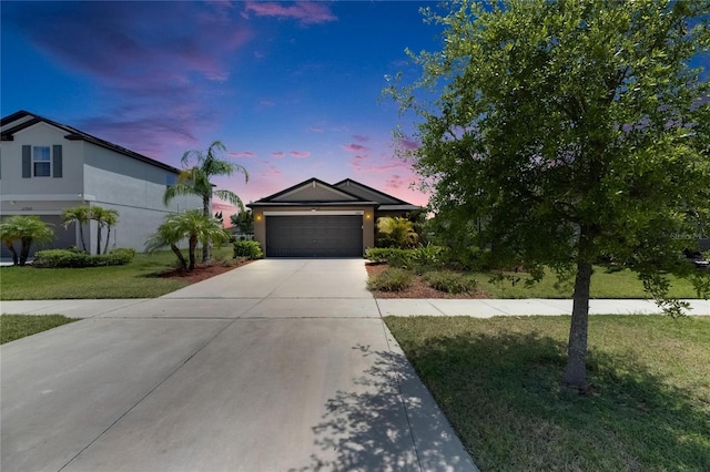 11707 Sunburst Marble Rd, Riverview, FL 33579 - ranch-style home with driveway, a garage, a lawn, and stucco siding