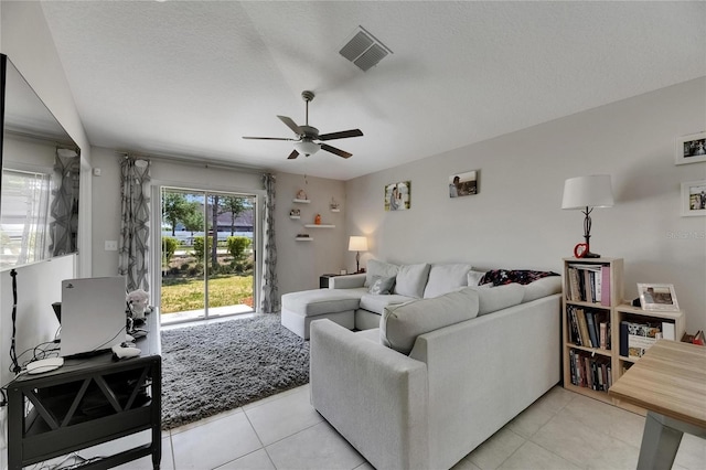 11707 Sunburst Marble Rd, Riverview, FL 33579 - living area with a ceiling fan, light tile patterned flooring, and a textured ceiling