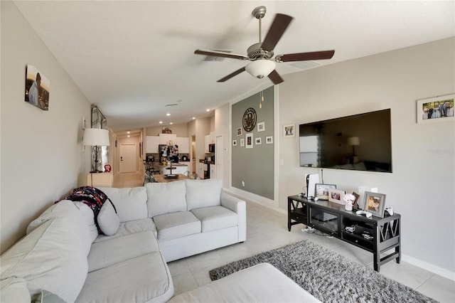 11707 Sunburst Marble Rd, Riverview, FL 33579 - living area with a ceiling fan, light tile patterned flooring, and baseboards