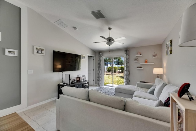 11707 Sunburst Marble Rd, Riverview, FL 33579 - living room with a ceiling fan, baseboards, lofted ceiling, and light tile patterned flooring