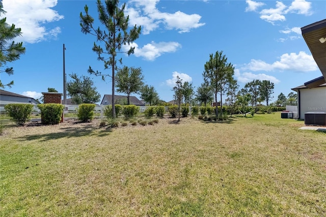 11707 Sunburst Marble Rd, Riverview, FL 33579 - view of green lawn featuring central AC