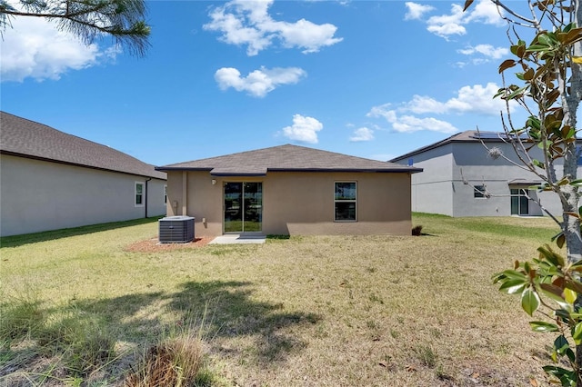 11707 Sunburst Marble Rd, Riverview, FL 33579 - back of house with stucco siding, central air condition unit, and a yard