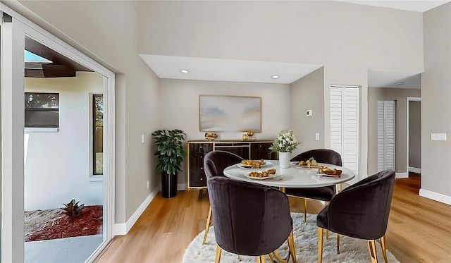 dining area with recessed lighting, baseboards, and light wood-type flooring